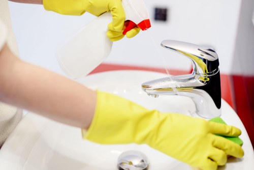 Local cleaner treating sofa stains in a Shoreditch flat