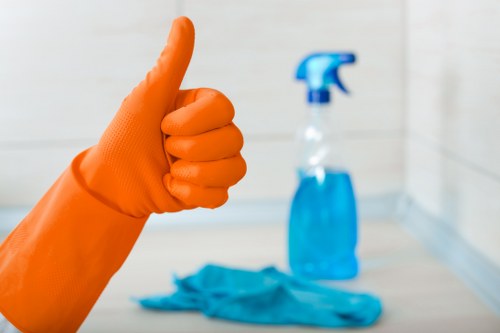 Cleaning staff managing waste responsibly during a service visit
